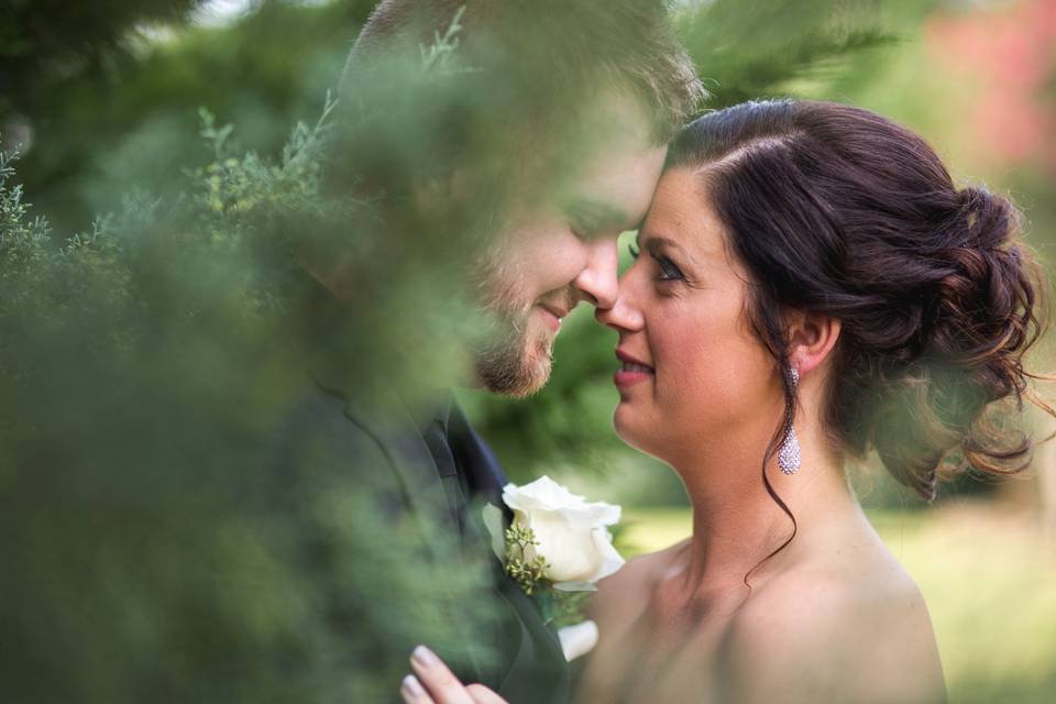 Bride and groom in vegetation