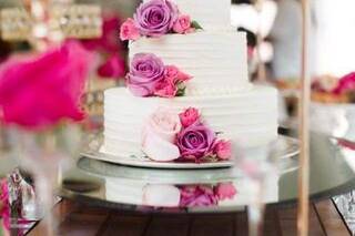 White cake with pink flowers