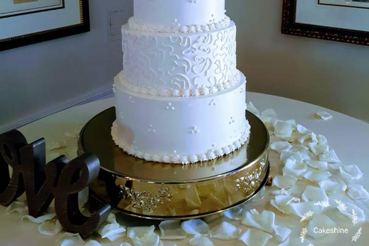 White wedding cake with topper