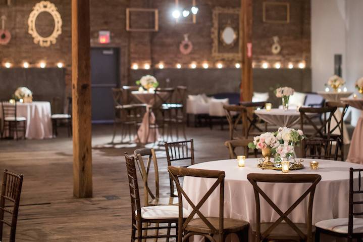 At the reception we transformed the space with warm ambient lighting and a vintage frame, floral wreath and mirror backdrop where guests danced the night away under the twinkling cafe lights and chandeliers.