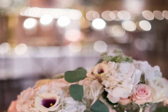 At the reception we transformed the space with warm ambient lighting and a vintage frame, floral wreath and mirror backdrop where guests danced the night away under the twinkling cafe lights and chandeliers.