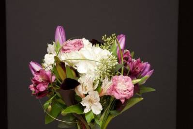 Hand Tied Bridal Bouquet:
Hydrangea, Listianthus, Stock, Tulips, Protea, Alstroemeria Lilies, loops of Bear Grass