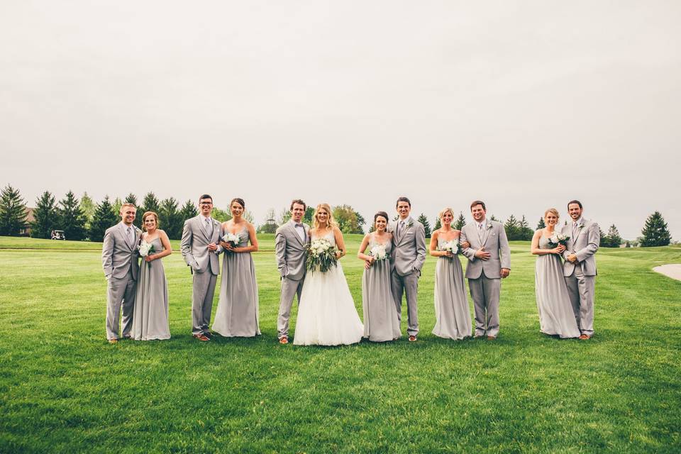 The couple with the bridesmaids and groomsmen