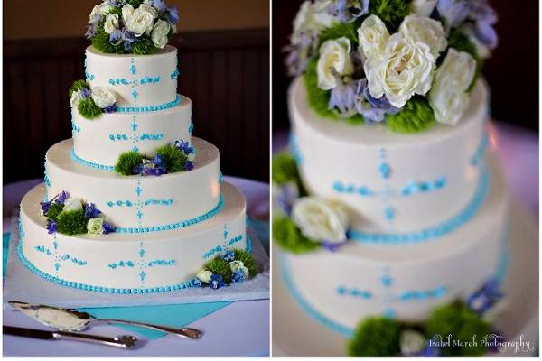 Their beautiful wedding cake topped with fresh flowers as seen throughout their wedding day.