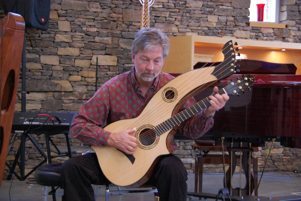 Looking at his guitar