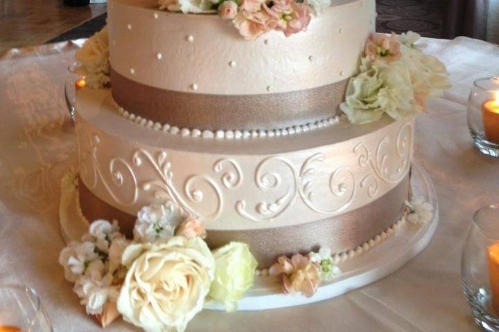 Intricate Lace piping covers this taupe colored buttercream cake.