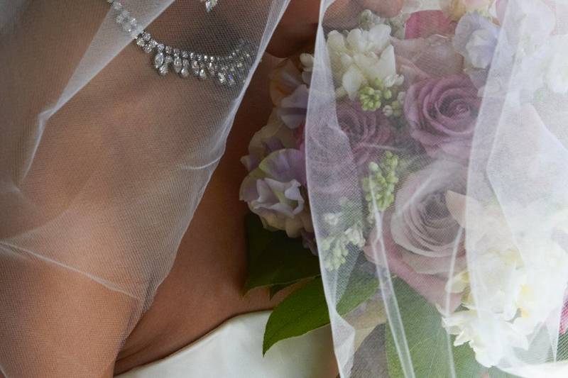 Large tulle birdcage and flowers on a separate comb, by Capelli Fiore.  Rhinestone earrings and necklace from The Something Old Collection.  Beautiful!