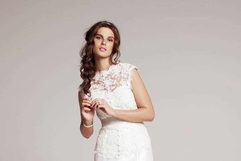 Heidi Elnora - Katie Grace- This Heidi Elnora raw silk ball gown features an alencon lace jacket that lays over a scoop neck strapless off-white bodice and skirt that features pockets.