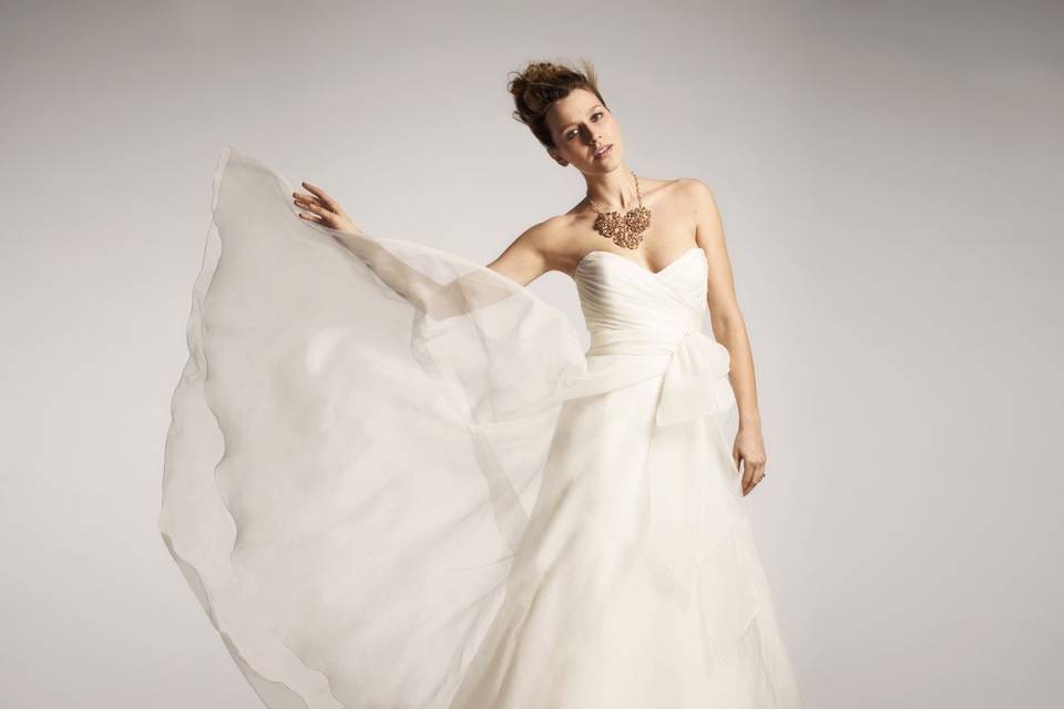 Nouvelle Amsale- #R102GThis Amsale silk organza A-line ballgown features a ruched sweetheart neckline and a flowing skirt tucked in the back for a modern draping effect.