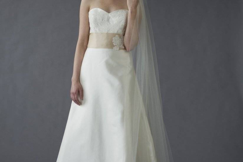 Caroline DeVillo - Maddie - A sweetheart neckline and a romantic lace appliqué crown a subtly stunning mikado-silk A-line skirt with a chapel train.