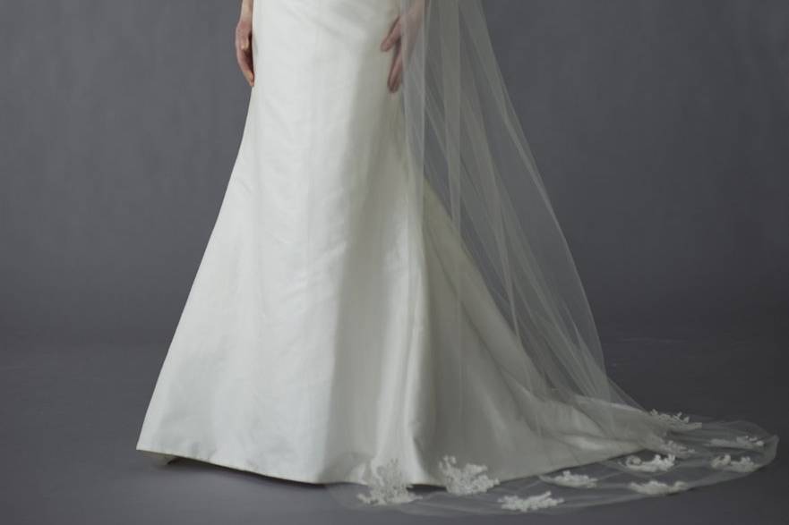 Caroline DeVillo- Elizabeth - A vision in ivory, this dupioni-silk gown owes its breathtaking minimalist beauty to a sweetheart neckline and a graceful, fluted skirt with a chapel train.