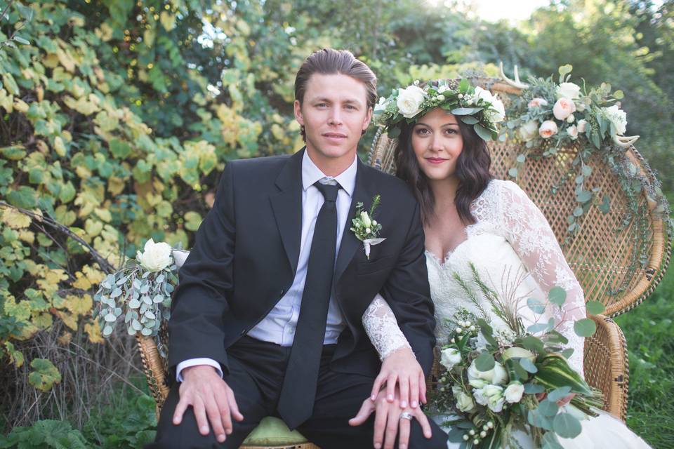 Couple surrounded by floral arrangements