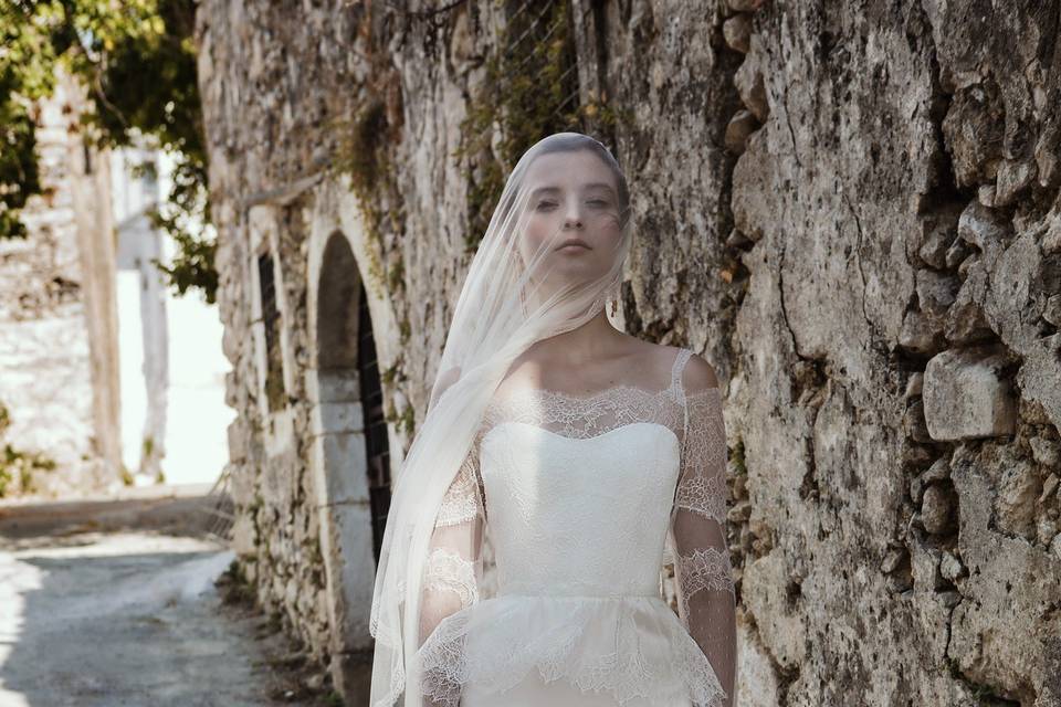 Look 21 Cybele - Off shoulder lace gown with 3/4 length sleeves, lace peplum & silk satin skirt & Lace trimmed soft silk veil