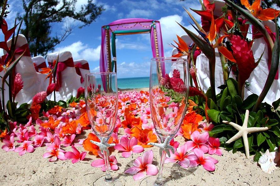 Bright colors including fresh birds of paradise and indigenous greenery - a stunning tropical ceremony.