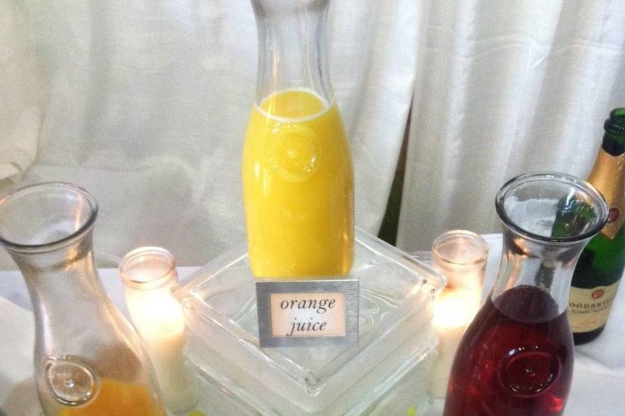 Mimosa bar with freshly squeezed orange juice, pear nectar, cranberry juice and peach nectar