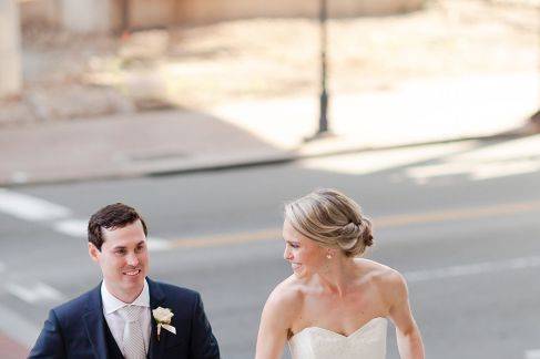 Newlyweds walk up the stairs