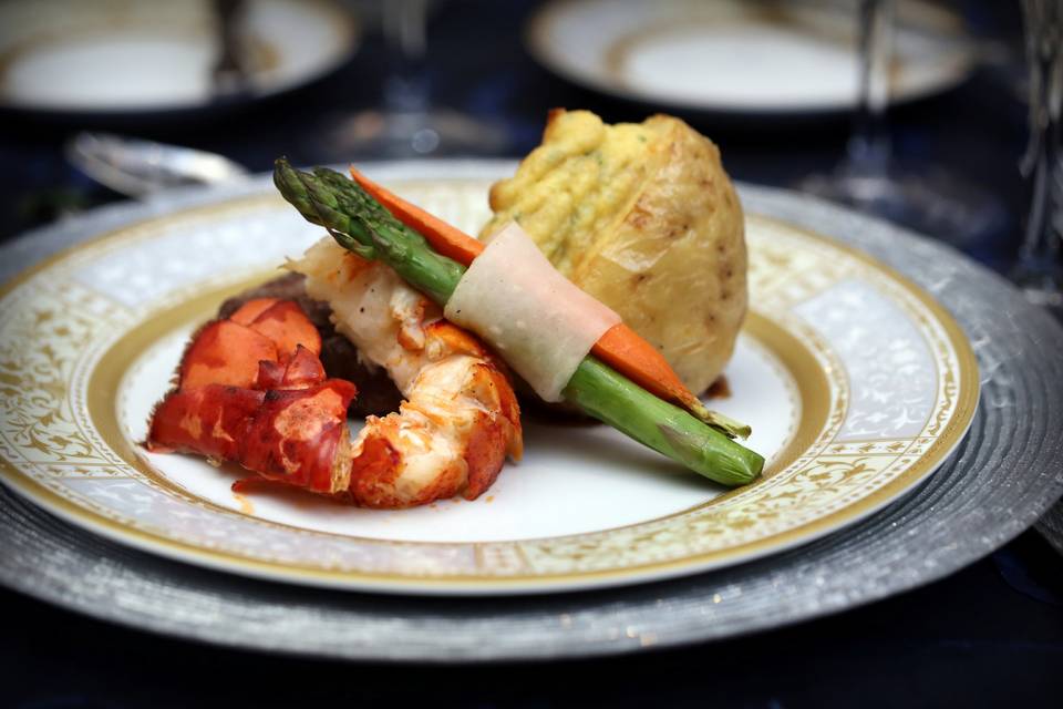 Lobster tail with pommes duchess, asparagus and baby carrot bandol