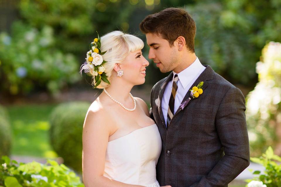 Couple hold hands in the garden