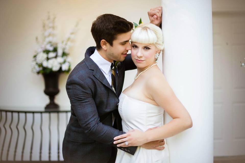 Couple pose by a column