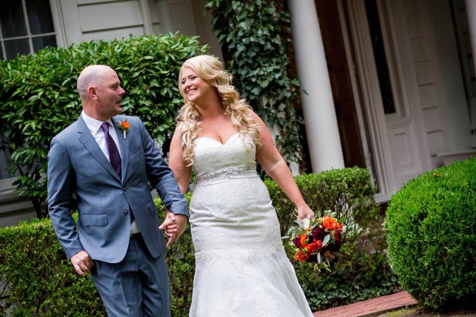 Couple walk along the lawn