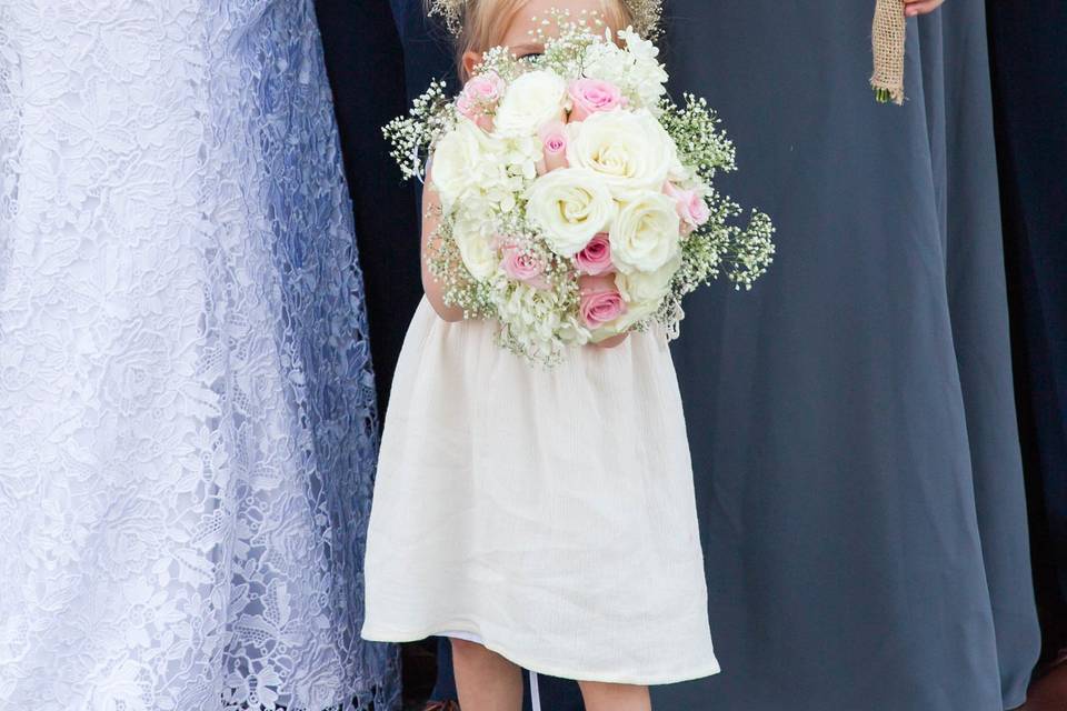 Junior bridesmaid holding the bouquet