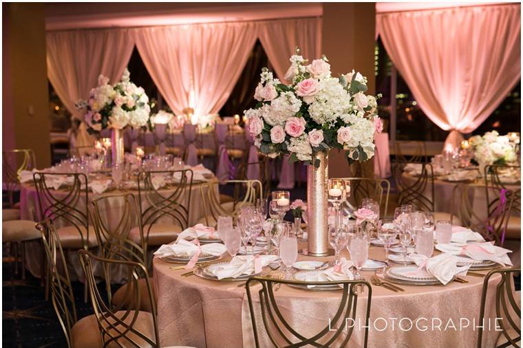 Gold LaCorde chairs and raised floral centerpieces