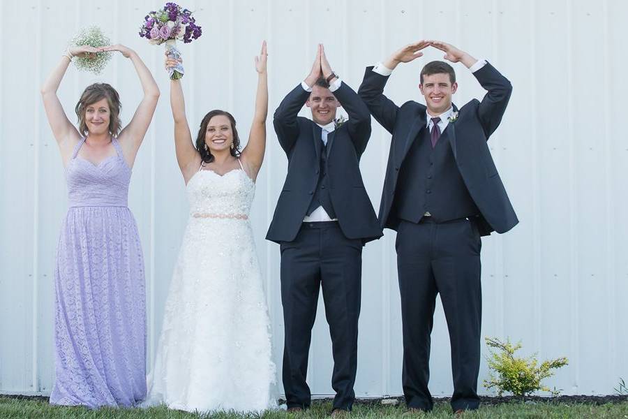 Newlyweds and wedding attendants