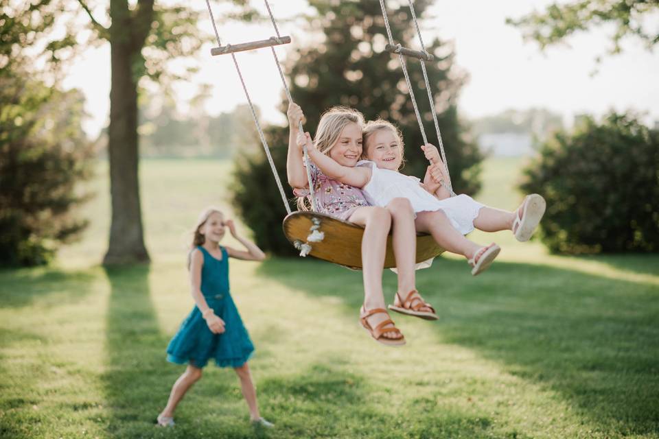 Tree swing with children