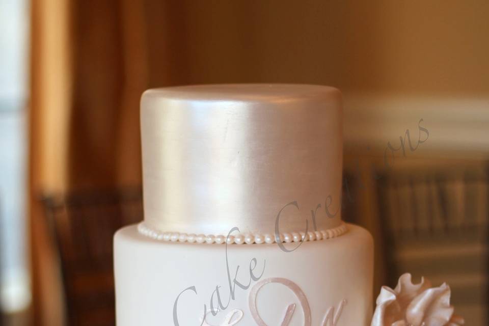 Wedding cake with rose gold top layer