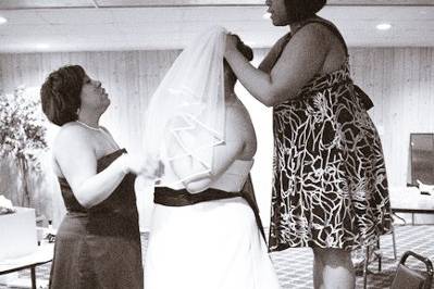 Christine's Matron of Honor and good friend help her finish getting ready for her big moment