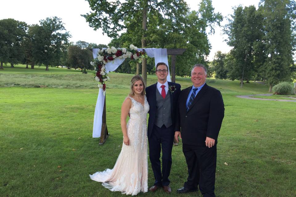 Newlyweds and their officiant