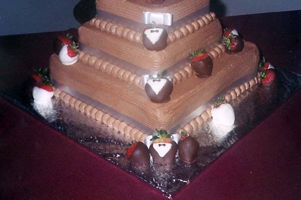 Three Tiered All Chocolate Grooms Cake w/ White & Dark Chocolate Covered Strawberries & Chocolate Buttercream Roses.