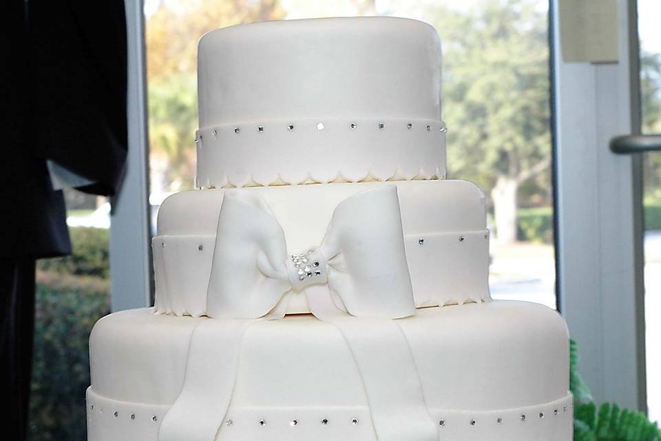 Three Tiered Elegant All White Wedding Cake w/ Rhinestone, Fondant Ribbon & Bow.