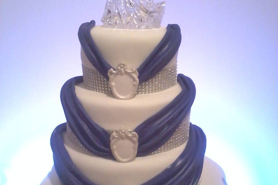 Four Tiered Fondant Wedding Cake, With Fondant Swags and Brooches.