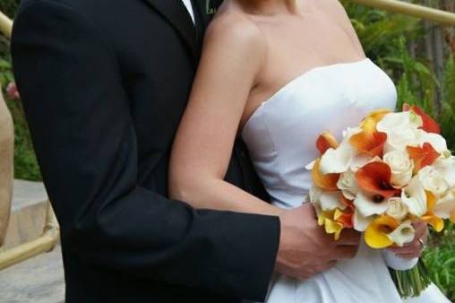 Groom holding his bride