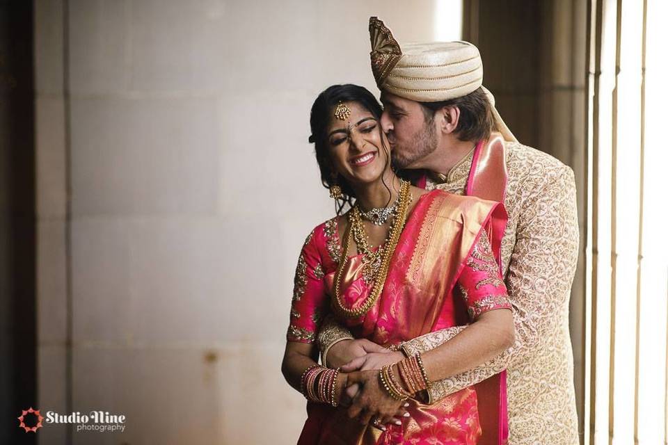 Groom kissing his bride