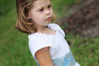 Eco Custom Peasant Style Flower Girl Dress. Made to order and available in sizes 12M to 8. Constructed from reclaimed cotton and customer specified accent fabric.