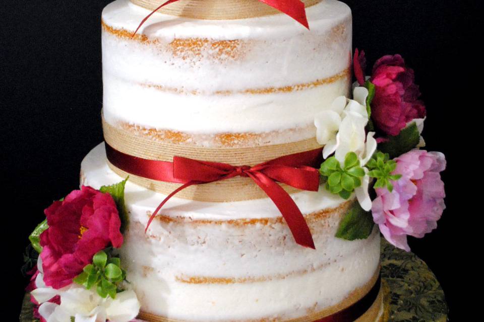 Naked cake with pink flowers