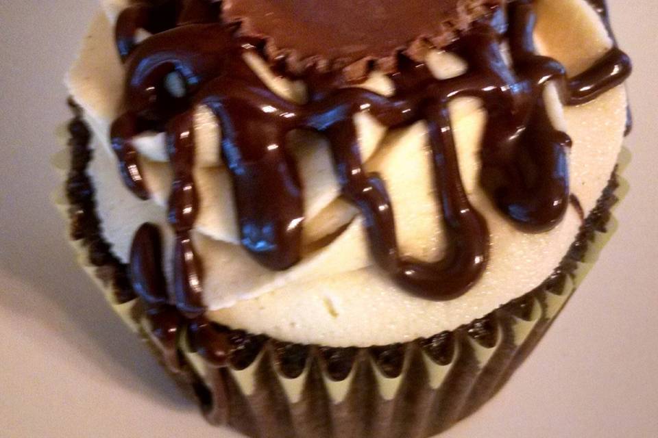 Reese's Shadow Cupcake.  A chocolate cupcake with peanut butter buttercream, chocolate ganache drizzle and reese's peanut butter cup