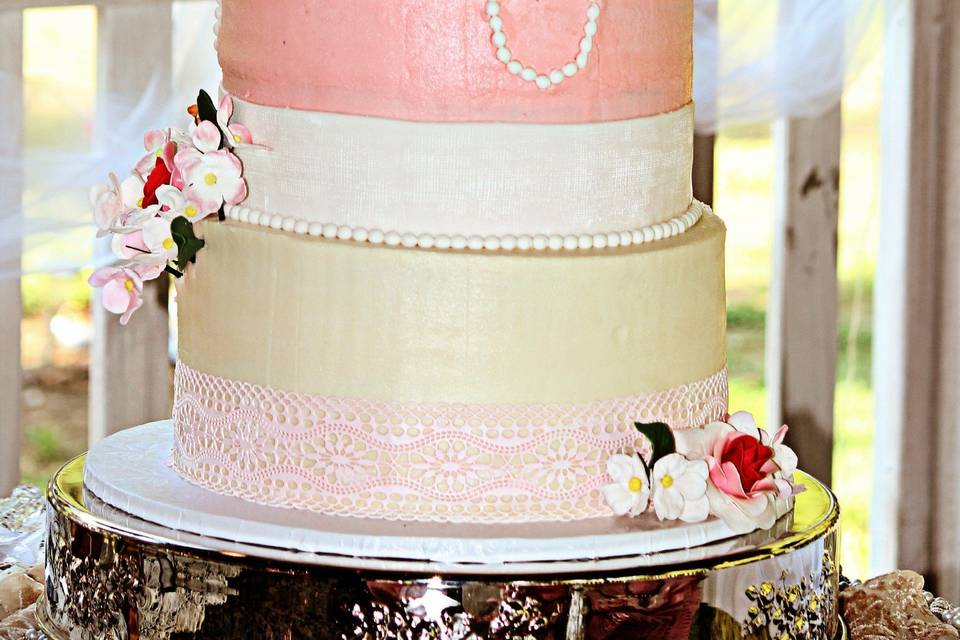 Vintage 4 tier cake with edible lace border, sugar pearls and handcrafted sugar flowers