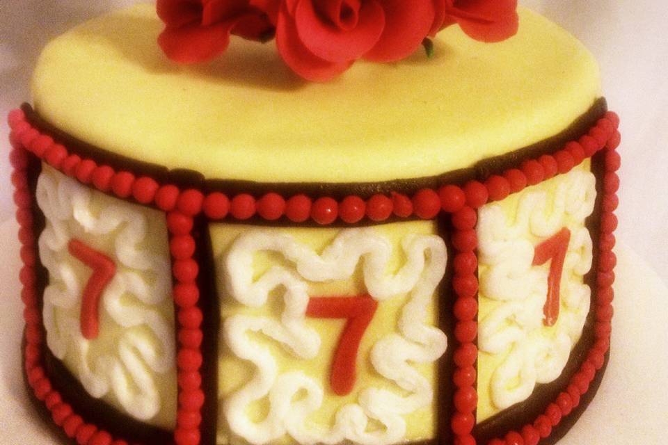 Lucky in Love themed cake with Isomalt heart, sugar roses, and fondant.