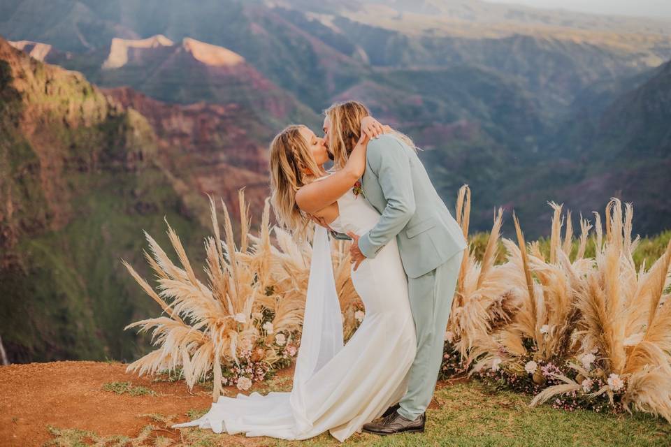 Couple embrace by canyon