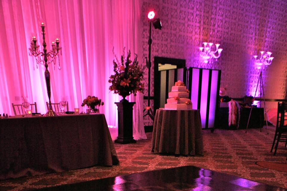 Another wonderful and detailed dancefloor treatment, as well as beautiful linear drape uplighting behind the head table.