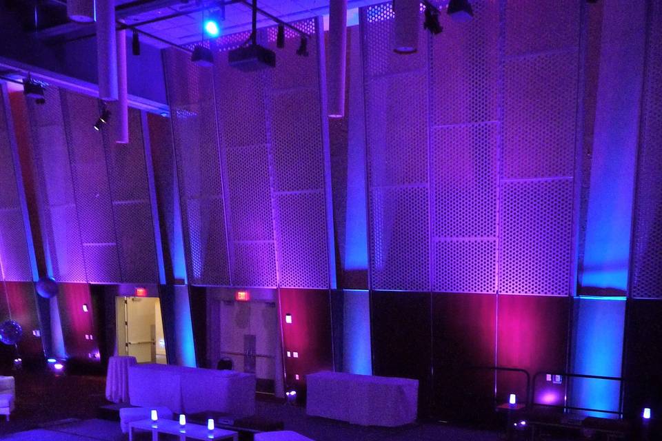 A chic, urban lounge was created in this large convention center exhibit hall for a very large wedding...we brought it down to earth for a little warmth and coziness with lots of varied uplighting and our wireless tabletop lanterns.