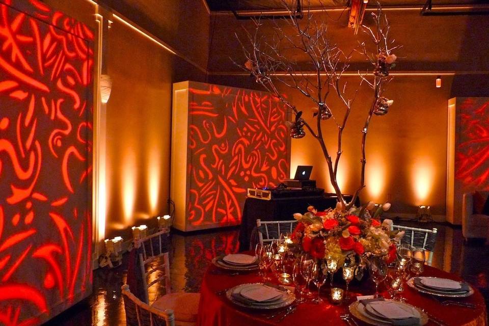 Rich, vibrant colors using both uplighting and pattern projection.  And, don't forget to pinspot those centerpieces!