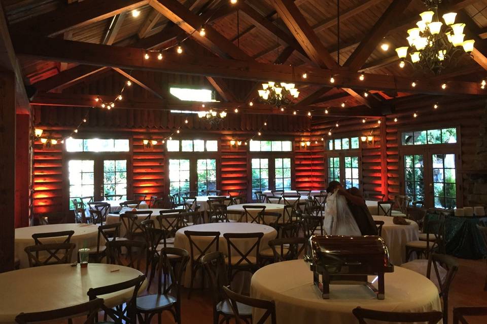 Simple, delightful, and totally appropriate lighting treatments for this log cabin styled venue!