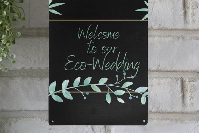 Welcome metal sign on brick