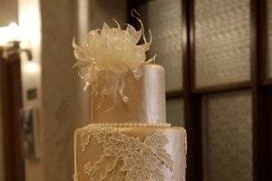 Beige wedding cake with white patterns