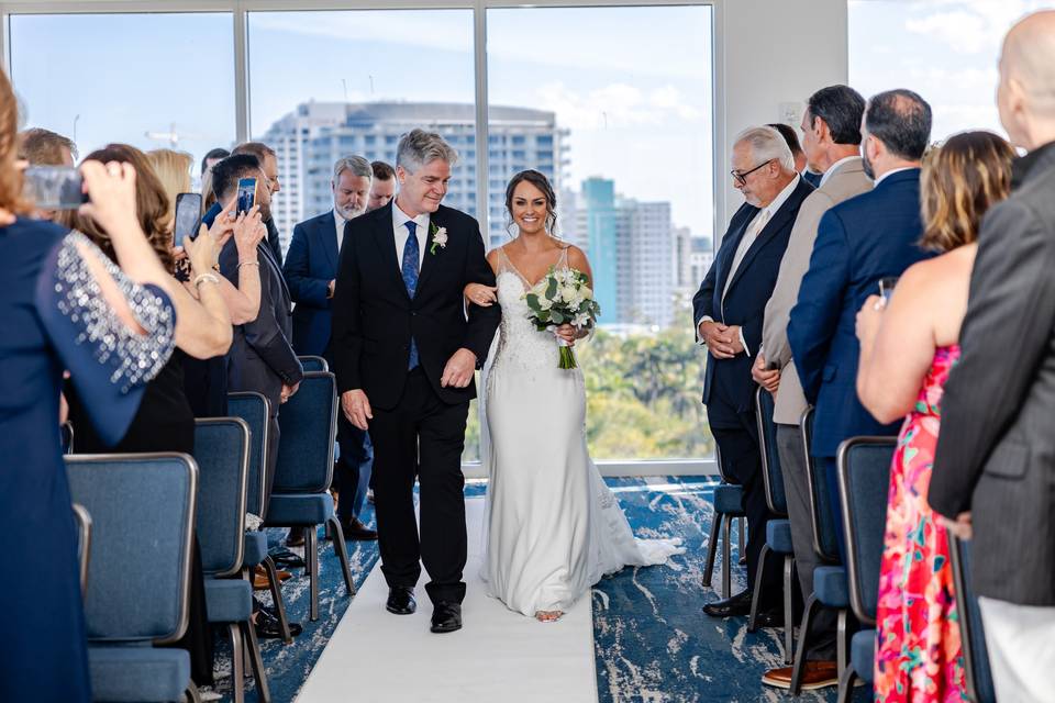 Father walks bride down aisle