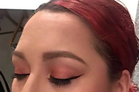 Light red eyeshadow to match bride's red hair